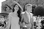 Наиболее заметным гостем на свадьбе был актер Джордж Клуни с супругой Амаль  (фото: Gareth Fuller/Pool/Reuters)