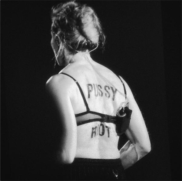 В конце исполнения первой песни Мадонна сняла с себя кофту, осталась в бюстгальтере, повернулась спиной к залу, и каждый смог увидеть, что на ее спине было написано чем-то черным «Pussy Riot»
