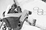 Российские сноубордисты Вик Уайлд и Алена Заварзина, завоевавшие золото и бронзу в соревнованиях по параллельному гигантскому слалому&#160;(фото: ИТАР-ТАСС)