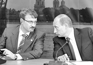 Президент России Владимир Путин и министр экономического развития и торговли РФ Герман Греф