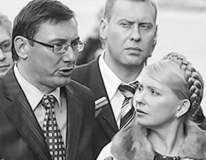 Юлия Тимошенко и ее бывший соратник Юрий Луценко (слева) рискуют попасть под конфискацию имущества