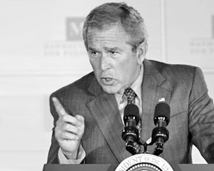 Буш угрожает КНДР