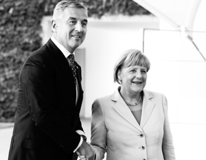 Черногорский правитель Мило Джуканович с канцлером Ангелой Меркель
