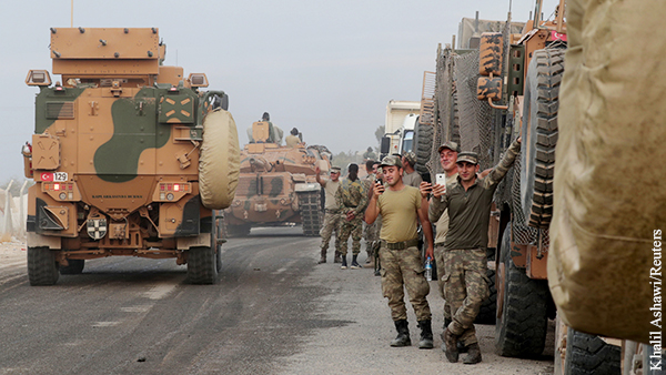Турция приостановила военную операцию в Сирии