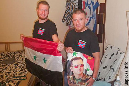 Моторола сфотографировался с портретом Асада