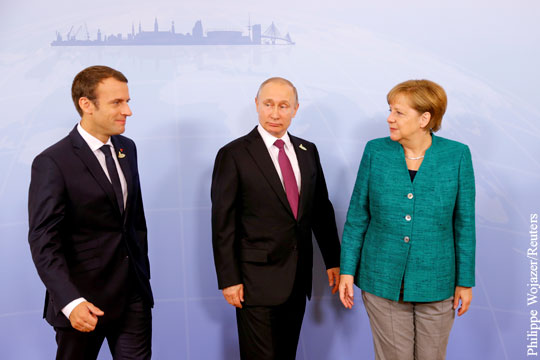 Путин отказался говорить о санкциях с Меркель и Макроном
