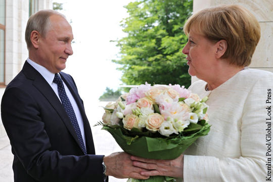 Немецкий таблоид увидел оскорбление в букете Путина для Меркель