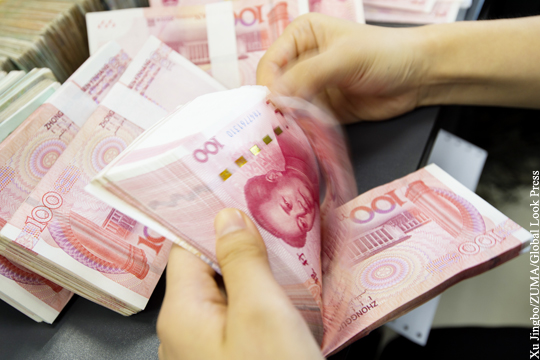 Китай снизил курс юаня к доллару до десятилетнего минимума